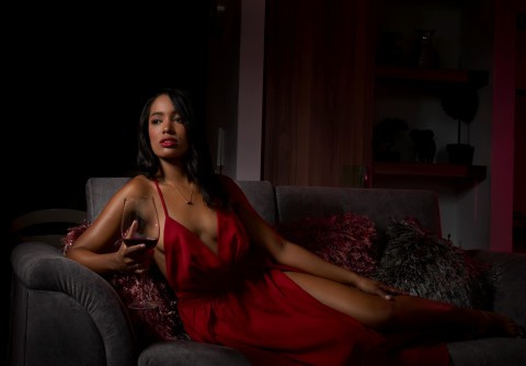 Escort making intense eye contact with client