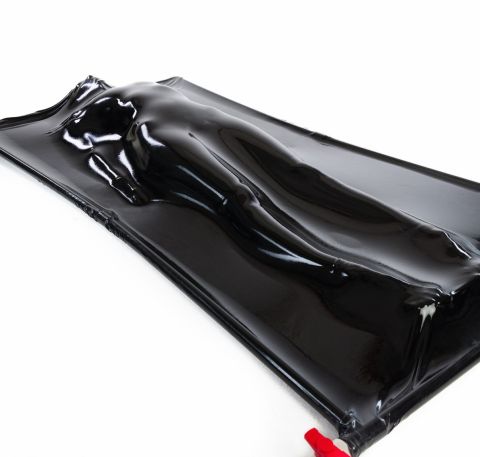 BDSM vacuum bed sealed around a body