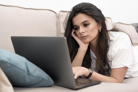 Woman boosting profile on escort directory.