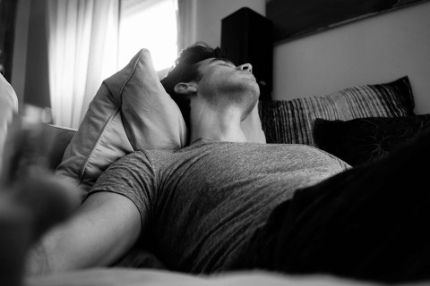 Man relaxing alone enjoying solo masturbation