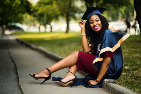Sex worker celebrating graduation in cap and gown