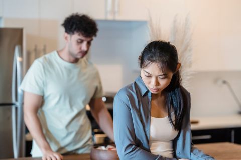 Sad woman looking away during conversation