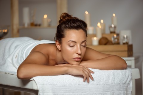 Person enjoying sensual massage experience