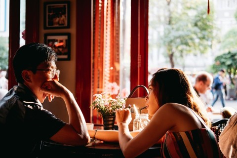 Two people enjoying a relaxed, sex-free escort dinner date.