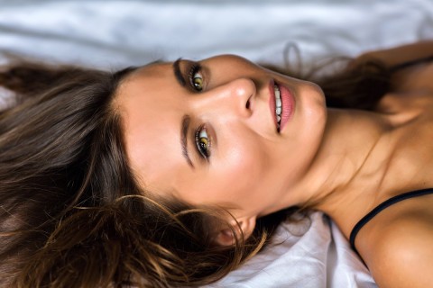 Female orgasm shown in soft moment.