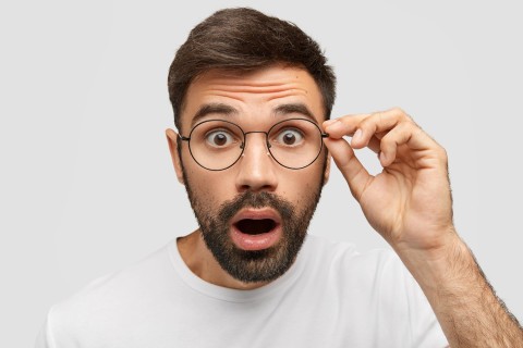 Surprised man amazed by unforgettable escort experience.