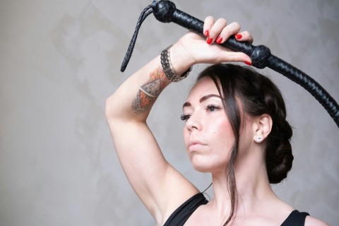 A seductive kinky escort ready for a session