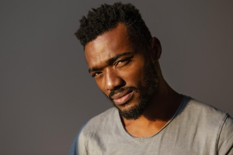 Male Black escorts standing confidently