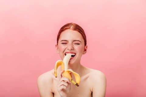 Sensual woman mastering oral seduction gracefully