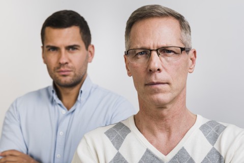 Young and older men symbolizing stages of male sexual performance
