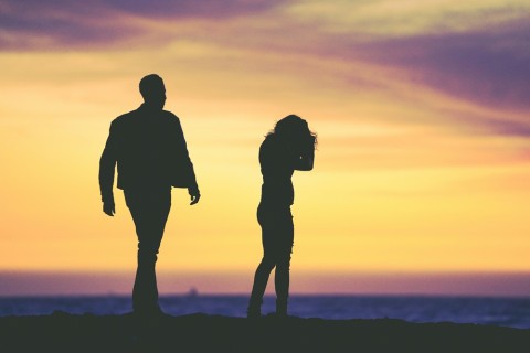 Lonely couple ignoring each other, escort offering genuine attention