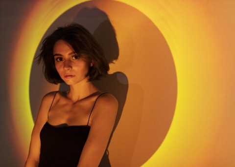 Young woman preparing for first escort job