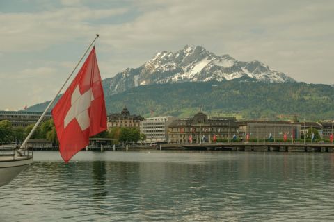 Swiss flag overlooking alpine escort market.