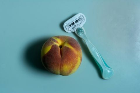 Woman choosing between natural and shaved intimate grooming styles