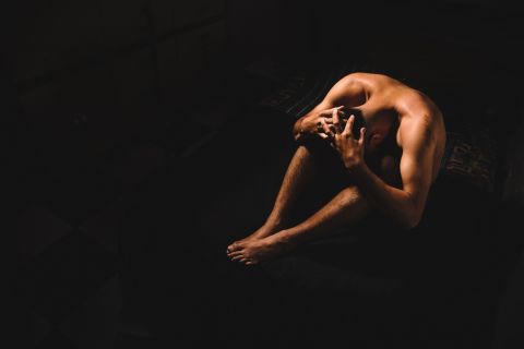 Stressed man experiencing erectile dysfunction symptoms