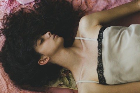 Woman expressing nymphomania through confidence and sensuality