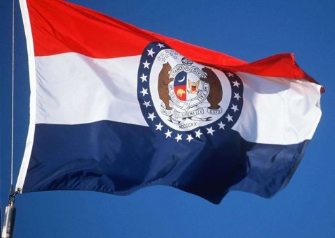 The official state flag of Missouri waving in the wind.