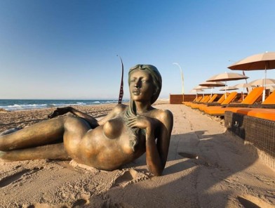 Naturist beach with open-minded travelers