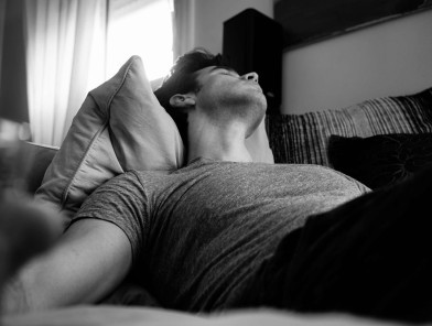 Man relaxing alone enjoying solo masturbation