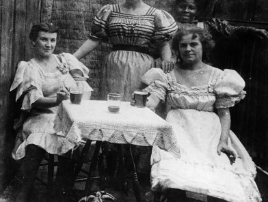 Wild West courtesans outside frontier saloon