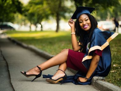 Sex worker celebrating graduation in cap and gown