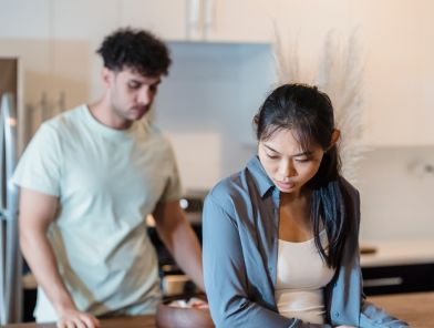 Sad woman looking away during conversation