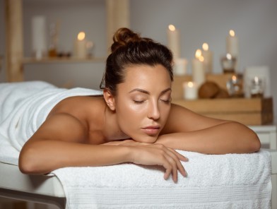 Person enjoying sensual massage experience