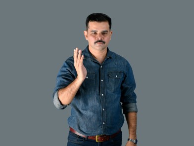 Aggressive man raising hand to threaten woman