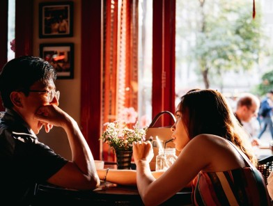 Two people enjoying a relaxed, sex-free escort dinner date.