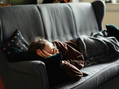 escort burnout woman lying on couch