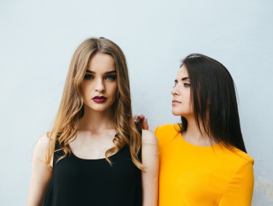 Escort vs girlfriend standing together