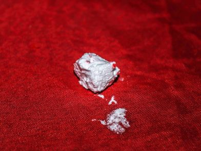 Drugs visible on table during client meeting