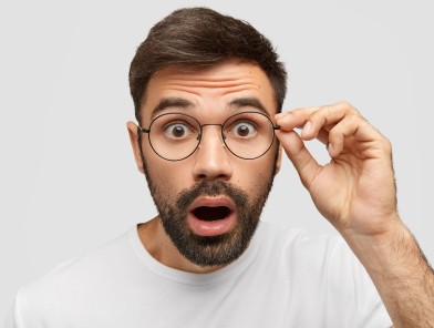 Surprised man amazed by unforgettable escort experience.