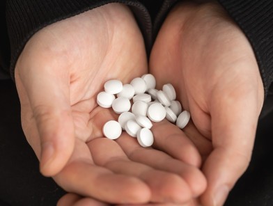 Illegal potency enhancers pills in hand