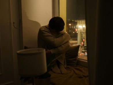 Escort sitting alone feeling emotionally lonely