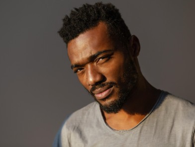 Male Black escorts standing confidently