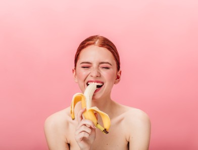 Sensual woman mastering oral seduction gracefully