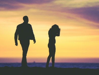 Lonely couple ignoring each other, escort offering genuine attention