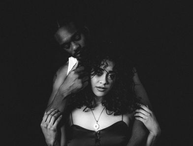 Husband of an escort hugging wife after work.