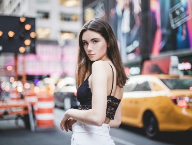 NYC escort woman waiting for client outdoors