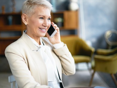 Older woman talking to male escort