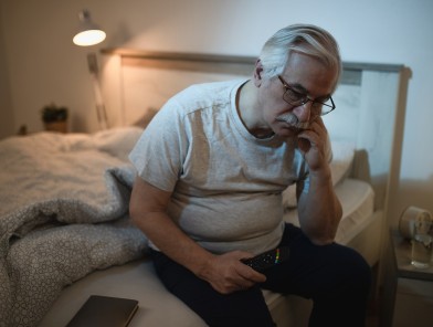 Middle-aged man reflecting on sexual health.