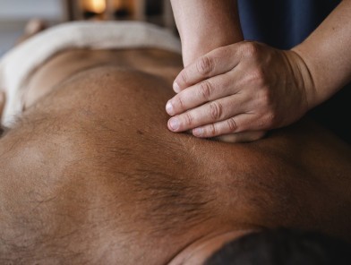 A man receiving a prostate massage treatment.