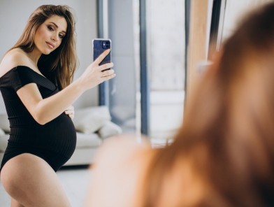 Pregnant escort woman with soft glow