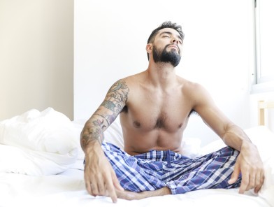 Man waking up thinking about sexual activity