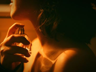 Woman choosing signature scent perfume collection escort