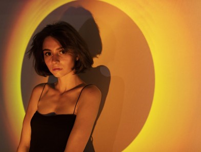 Young woman preparing for first escort job