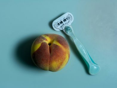 Woman choosing between natural and shaved intimate grooming styles