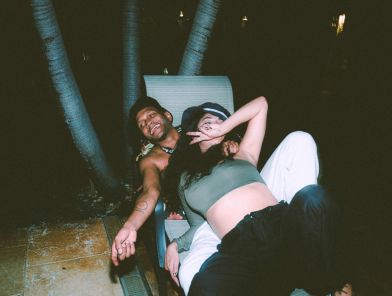 Couple escorts embracing with professional trust and love.