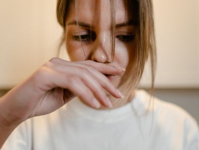 Woman reacting to unpleasant semen smell